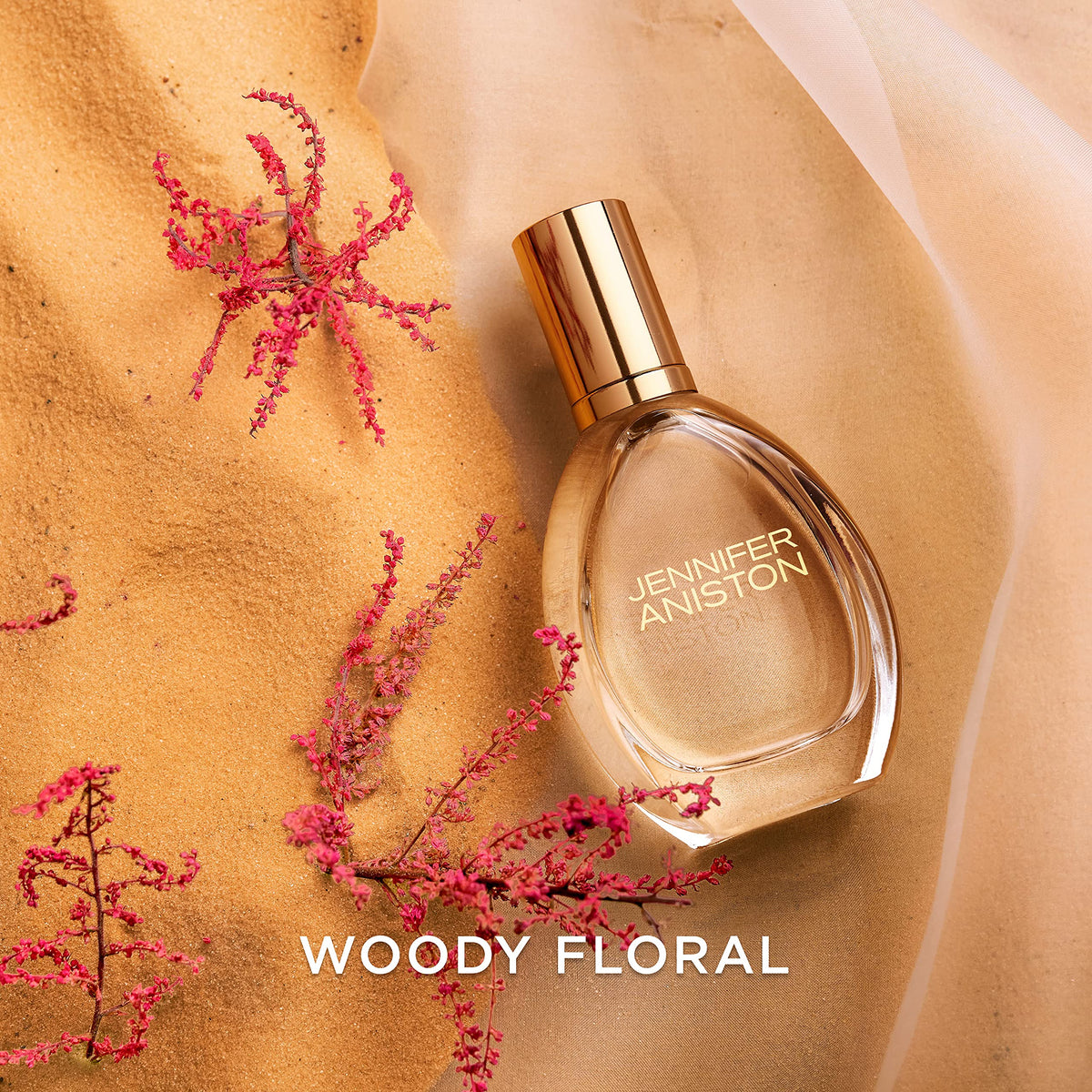 Jennifer Aniston Solstice Bloom fragrance sample with ribbon suggests gift-ready