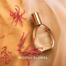 Jennifer Aniston Solstice Bloom fragrance sample with ribbon suggests gift-ready