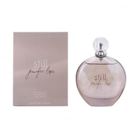 Gift-ready Still EDP packaging beside bottle, ideal for special occasions.