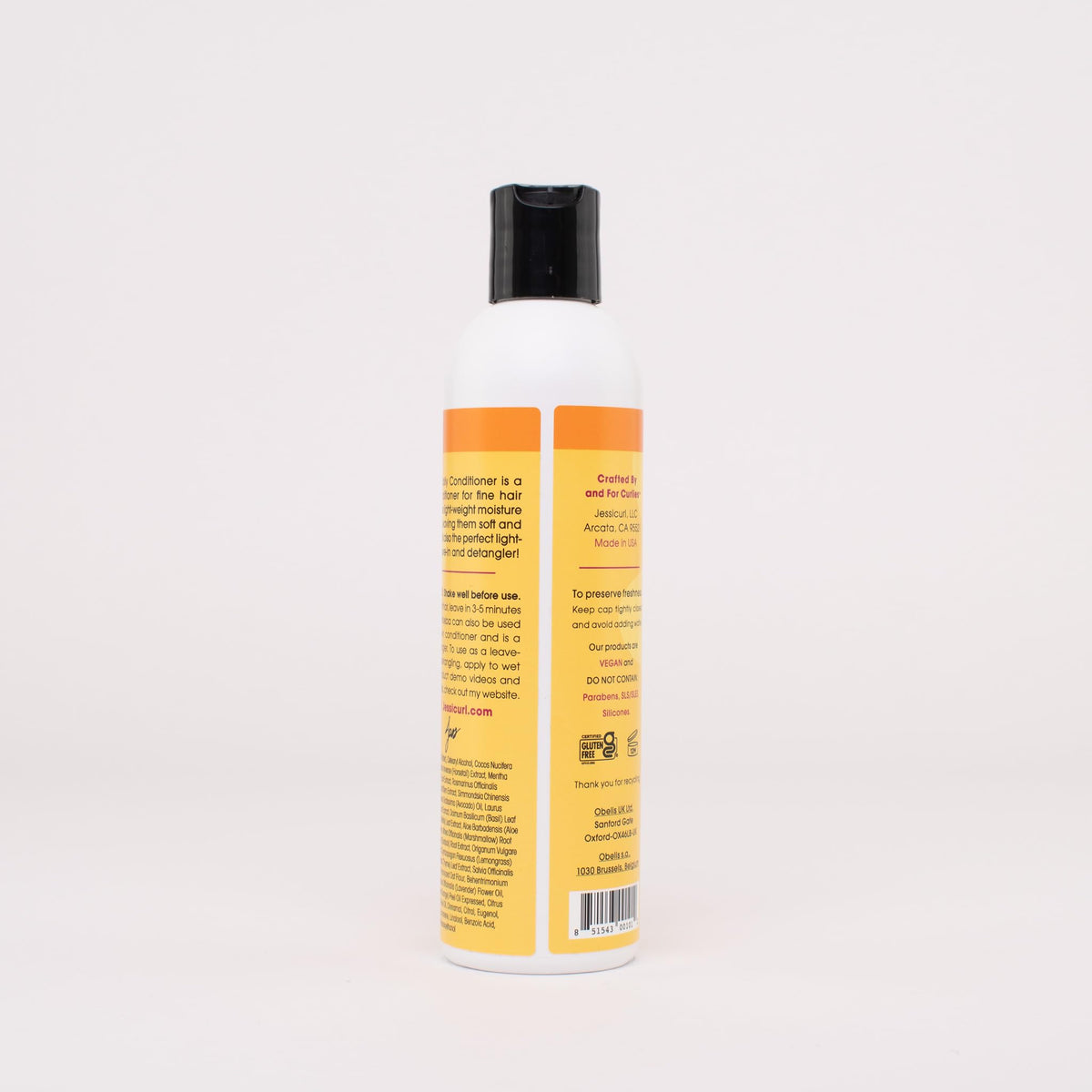 Product being worked through wet hair to reduce breakage with Aloeba.