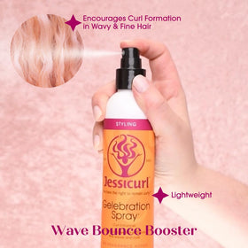 Applying Gelebration Spray to damp hair using the palm method for even coverage