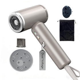 JIGGL dual-voltage mini travel dryer in gold, ultra-compact and ready for global use.