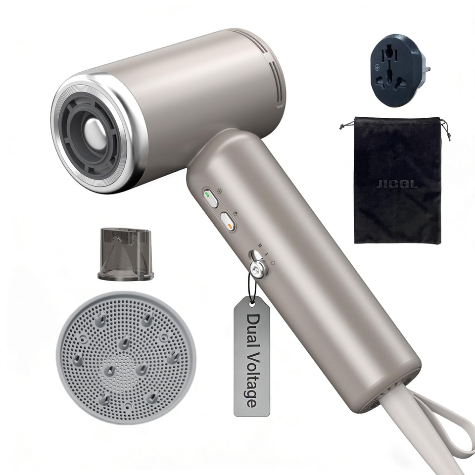 JIGGL dual-voltage mini travel dryer in gold, ultra-compact and ready for global use.