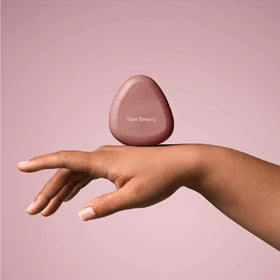 Compact 53ml tube from Rare Beauty for travel and daily desk use.