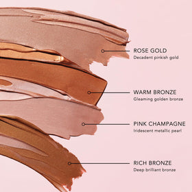JLO Beauty Complexion Booster drops applied on cheekbones for radiant, sheer shimmer.