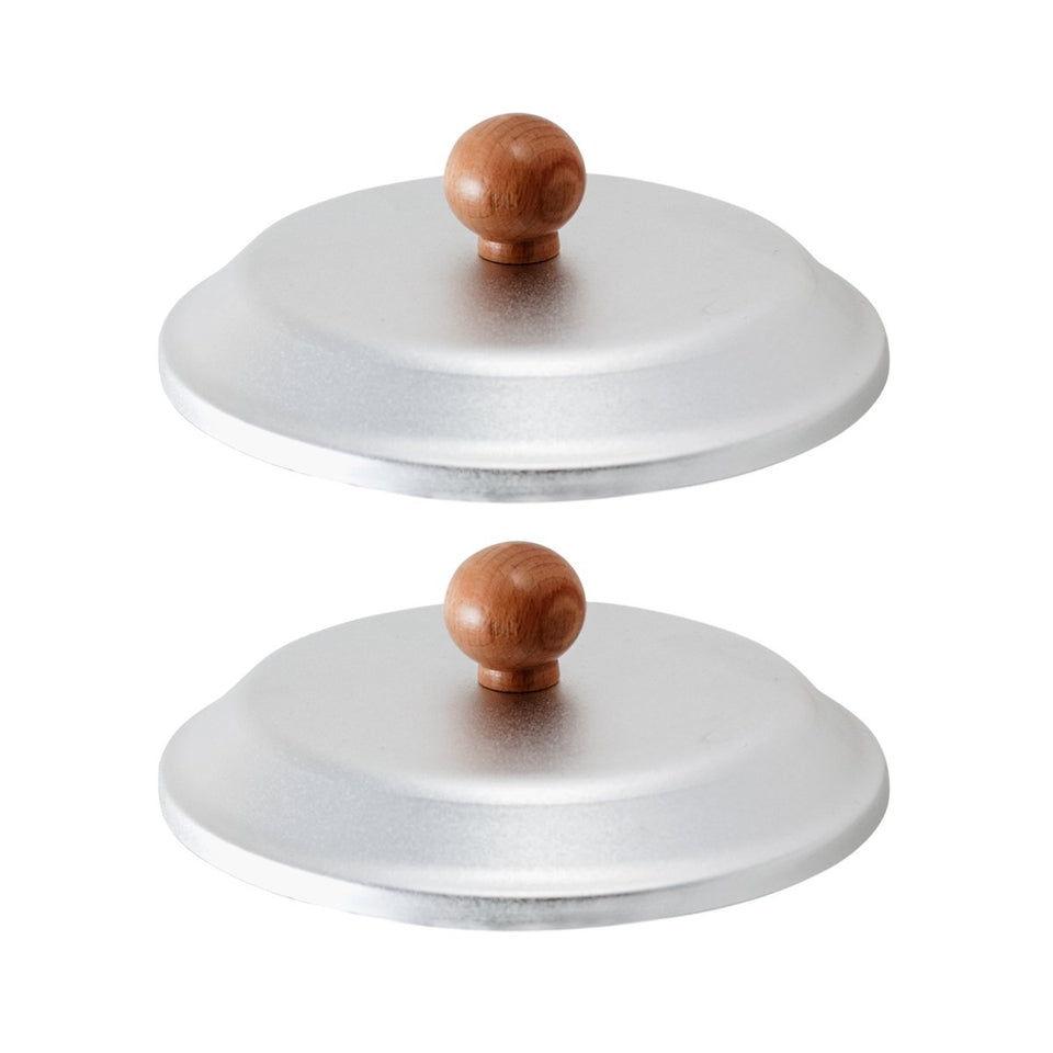 JMT Beauty wax tin lid set viewed from above, helps maintain steady wax temperature during sessions.