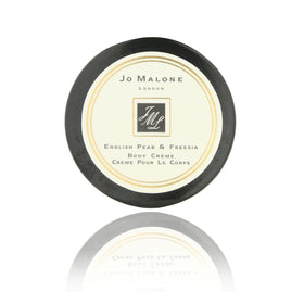 Jo Malone English Pear & Freesia mini body crème bottle for silky skin and subtle fragrance.