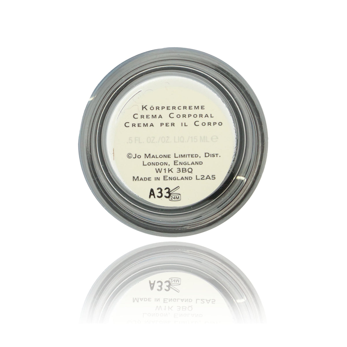 Jo Malone English Pear & Freesia mini cream being applied for travel-friendly moisture.