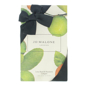 Jo Malone Lime Basil Mandarin application image hints at layering for a personalized fragrance ritual.