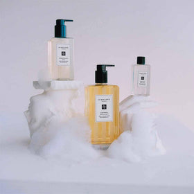 Jo Malone Lime Basil and Mandarin scent drops highlighting crisp mandarin and lime aromas.
