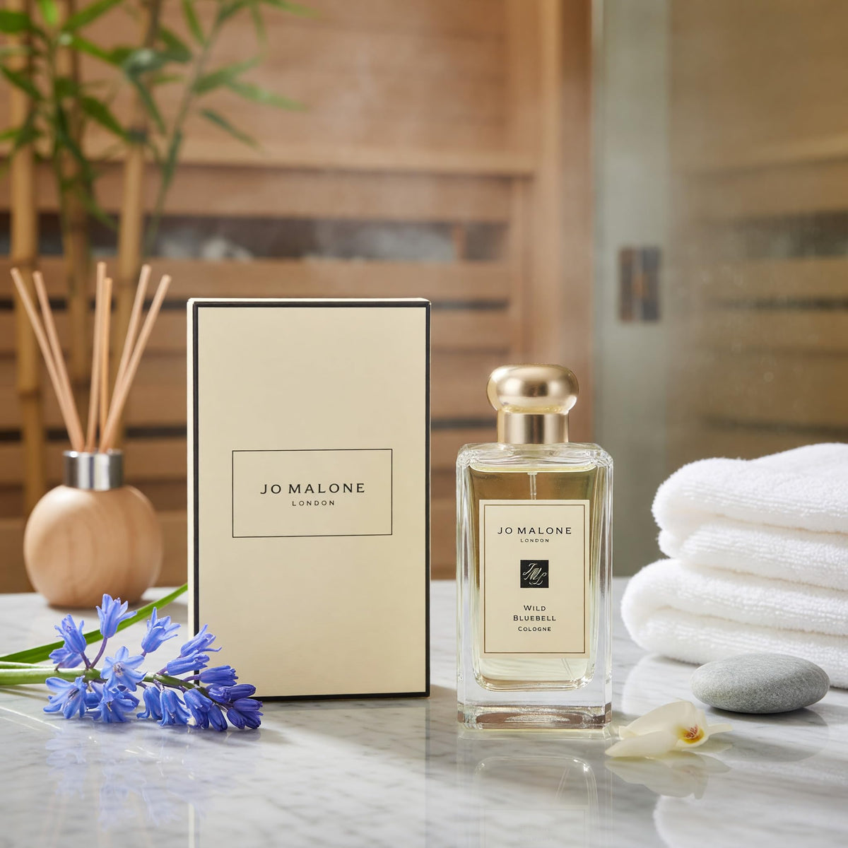 Jo Malone Wild Bluebell spray releasing a soft mist for everyday freshness.