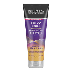 John Frieda Frizz Ease Miraculous Recovery bottle pour for smooth, frizz-free hair.