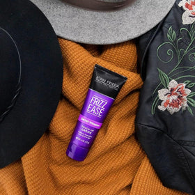 John Frieda Frizz Ease Secret Weapon creme applied to dry hair for smoothing