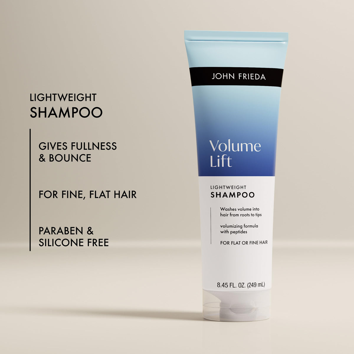 Pour action of John Frieda Volume Lift Weightless Shampoo into hand for easy use