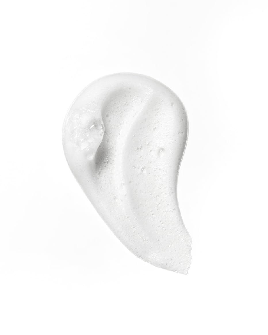 Close-up of foam texture showing creamy, flexible hold by John Masters Organics