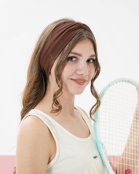 Jollybows no-slip headband stays in place during running or yoga.