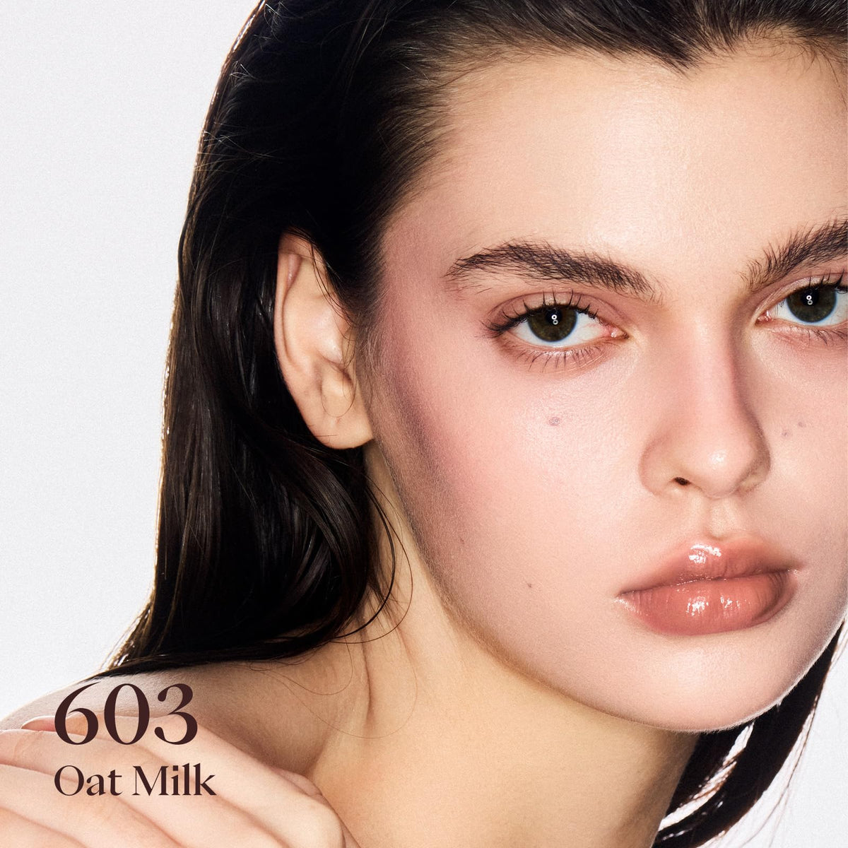 Joocyee Glazed Gloss 603 Oat Milk swatch shows buildable sheer color for natural enhancement.