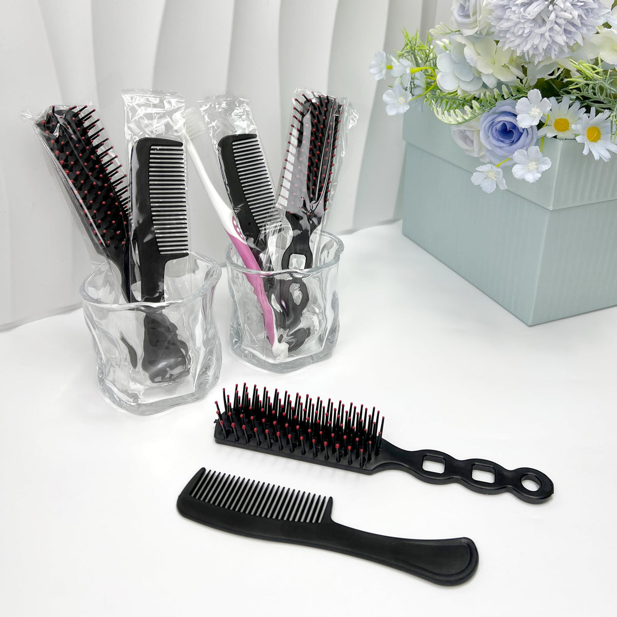 JoseHana individually wrapped hairbrush in black for hygiene and travel.