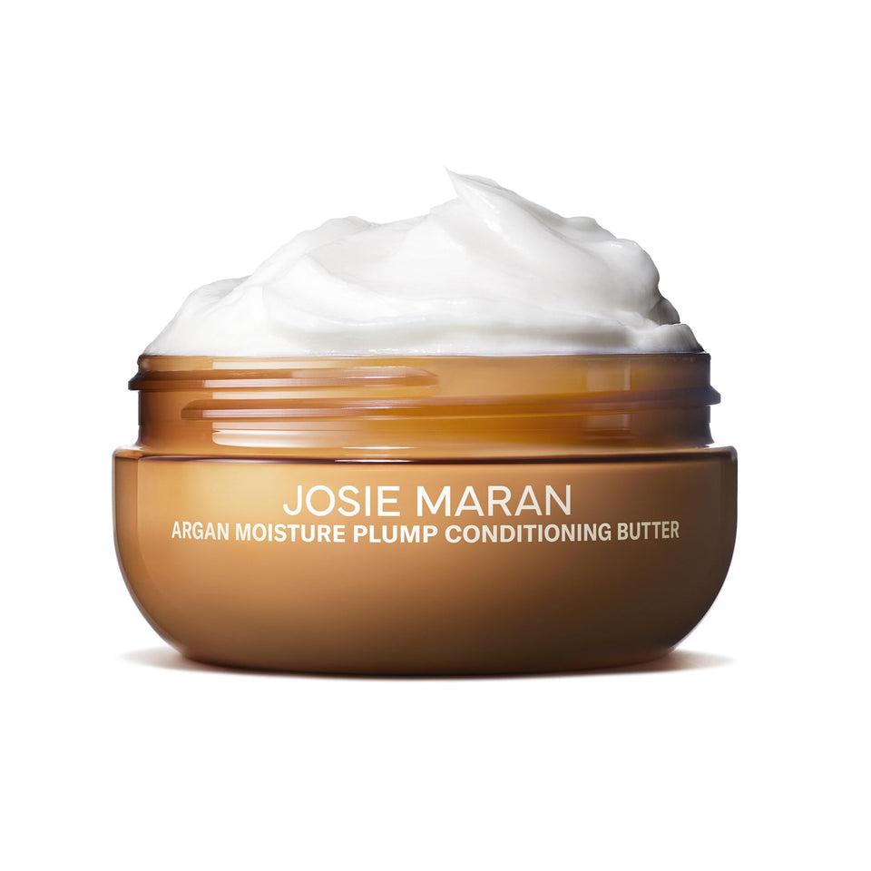 Josie Maran Argan Moisture Hair Conditioner Butter bottle close-up for hydration and volume.