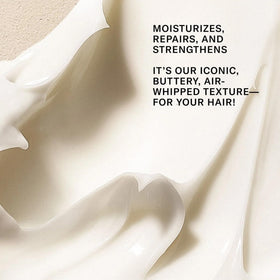 Josie Maran Argan Moisture Hair Conditioner Butter dispensing cream close-up.