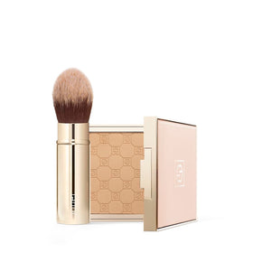Jouer travel-friendly retractable brush with compact gold handle for on-the-go touch-ups