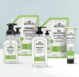 J.R. Watkins bottle being refilled with Aloe Green Tea for fresh hands.