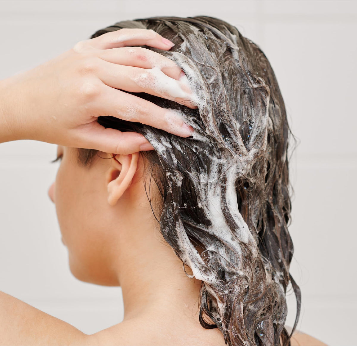 Close-up of rich lather from J.R. Watkins Daily Hydration Shampoo
