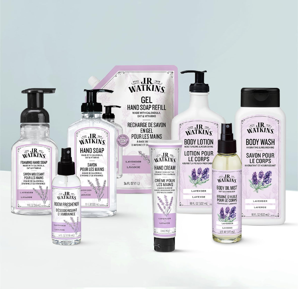 Lavender blossoms beside J.R. Watkins Body Oil Mist for calming aroma.