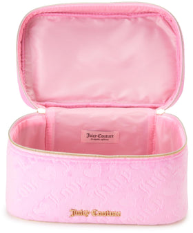 Juicy Couture pink makeup bag in luggage, easy packing for trips.