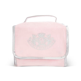 Juicy Couture pink makeup bag interior with organized compartments for travel cosmetics.