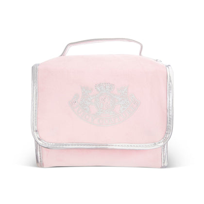 Juicy Couture pink makeup bag interior with organized compartments for travel cosmetics.
