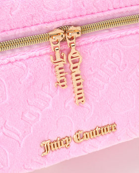Juicy Couture pink makeup bag zipper detail, secure closure for on-the-go packing.