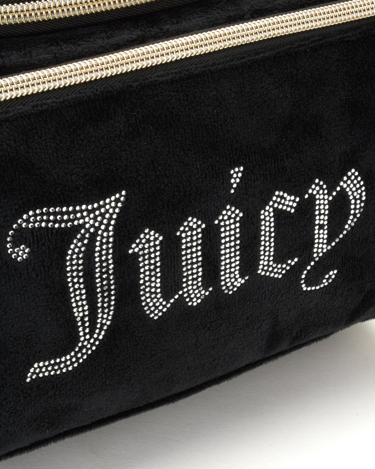 Juicy Couture travel toiletry kit compact design fits into luggage for easy packing.