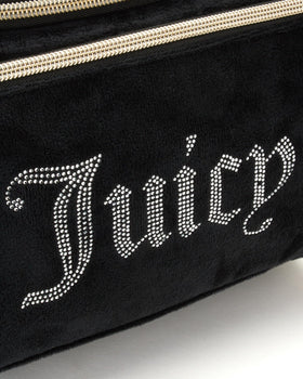 Juicy Couture travel toiletry kit compact design fits into luggage for easy packing.