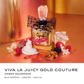 Close-up of Viva La Juicy bottle with pink label on a vanity