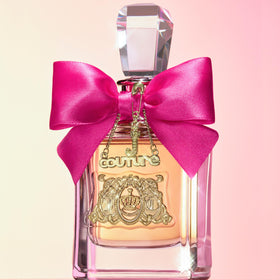 Juicy Couture Viva La Juicy display shot evokes party-ready fragrance lifestyle.