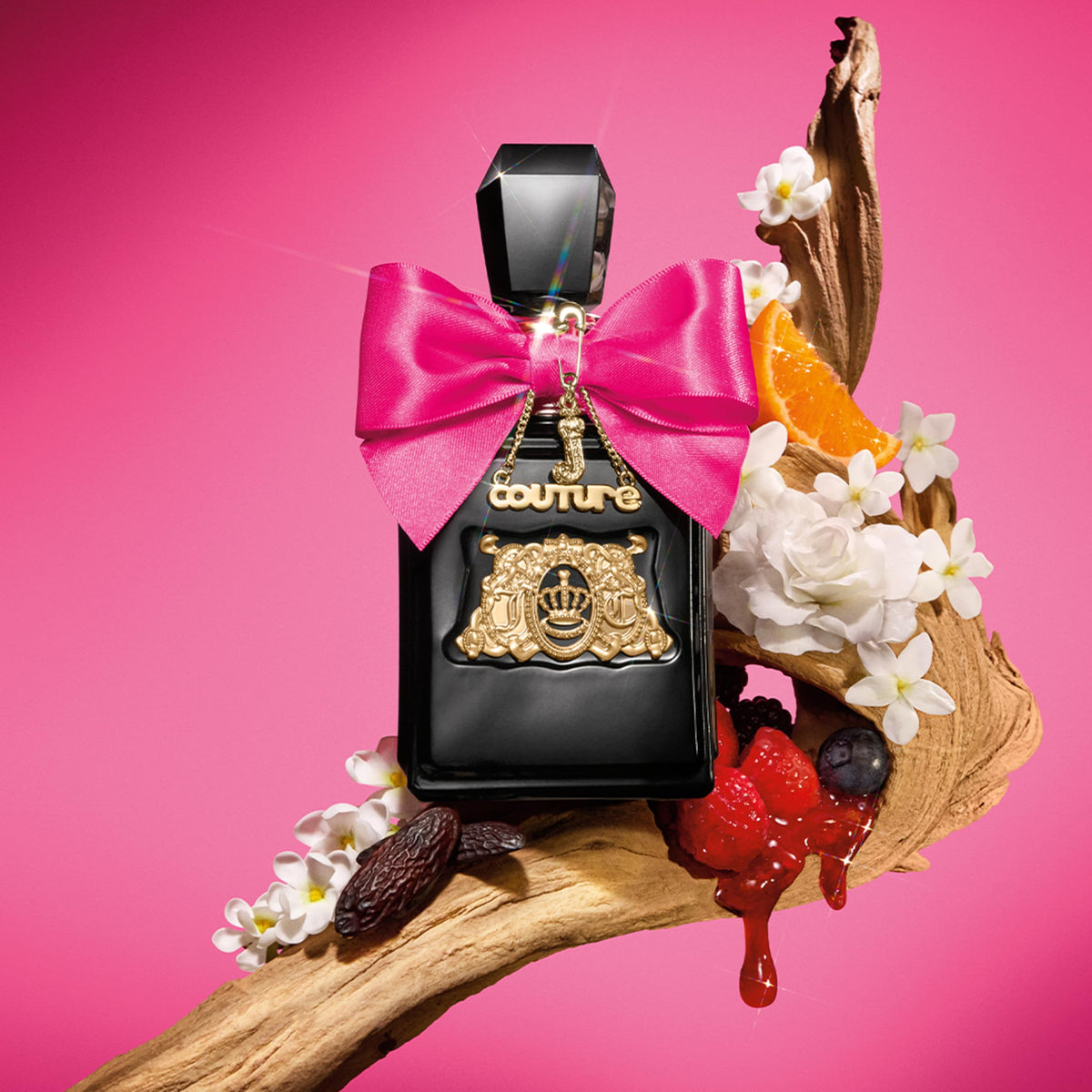 Juicy Couture Viva La Juicy Elixir wrist spray usage for on-the-go touch-ups.