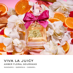 Juicy Couture Viva La Juicy flacon close-up emphasizes sparkling amber floral gourmand notes.