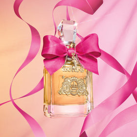 Viva La Juicy gift packaging with rose ribbon enhances gifting appeal.