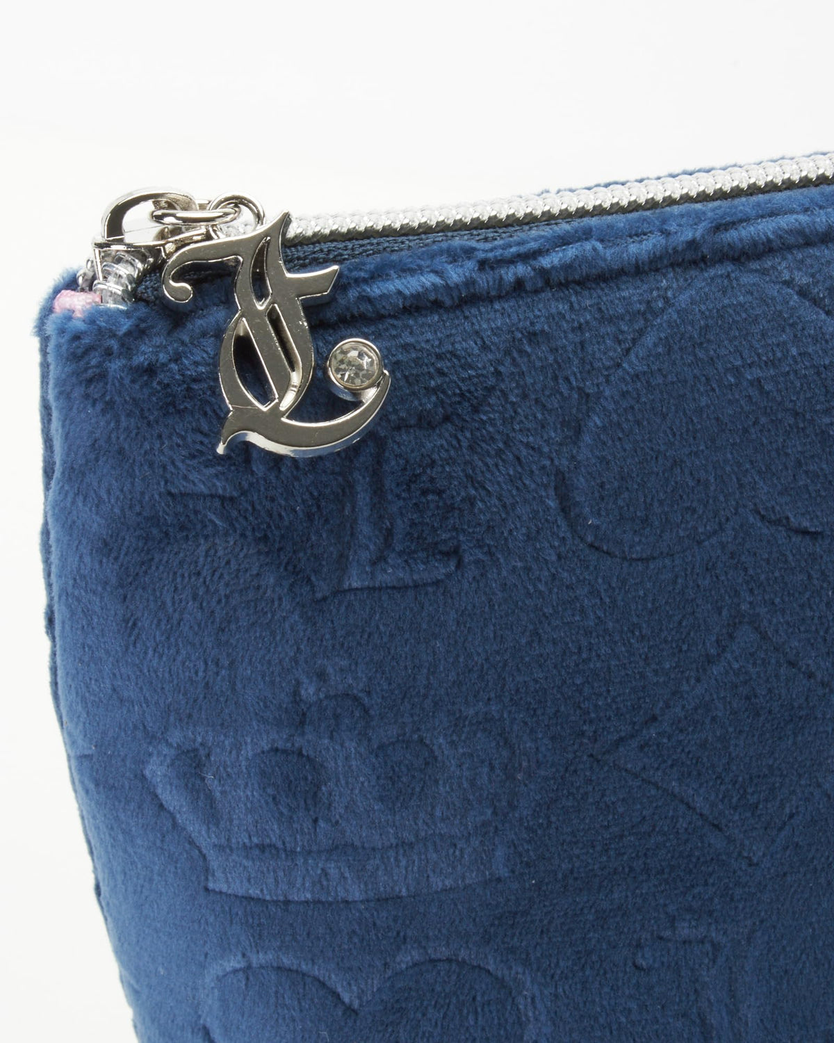 Compact Juicy Couture makeup bag fits easily in luggage for organized packing