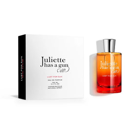 Juliette Has A Gun Lust for Sun bottle-cap close-up suggests premium sun-kissed allure.