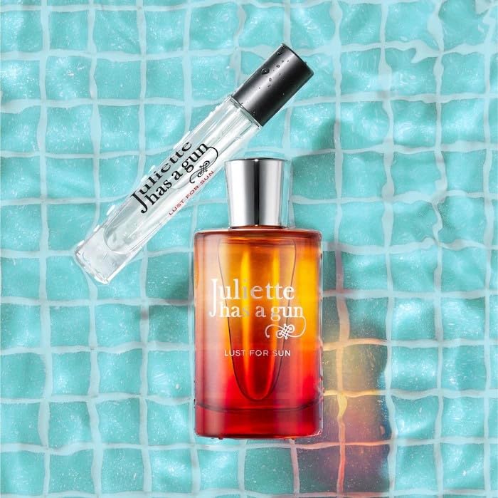 Juliette Has A Gun Lust for Sun packaging with golden hues evoking premium summer elegance and allure.