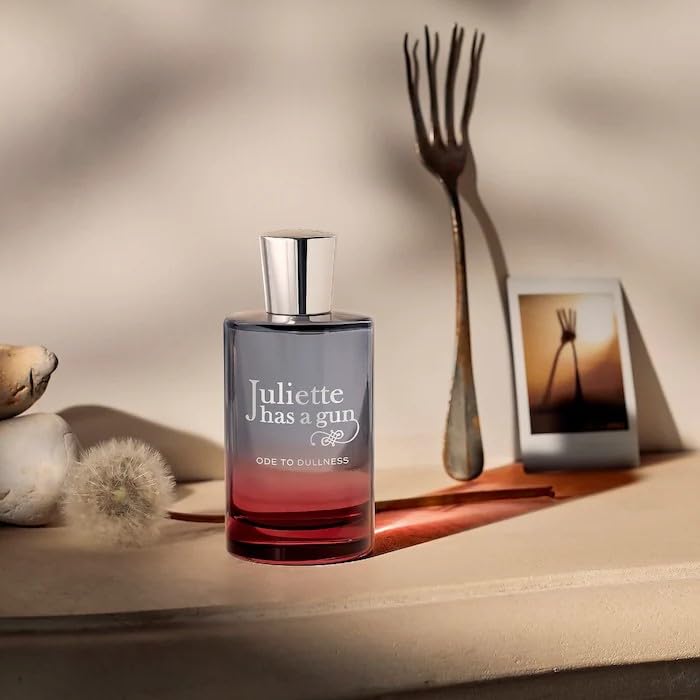 Juliette Has a Gun Ode to Dullness bottle in hand for travel aroma.