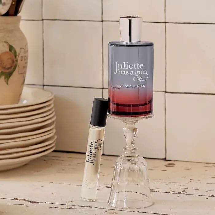 Juliette Has a Gun Ode to Dullness travel spray cap off for quick scent refresh.