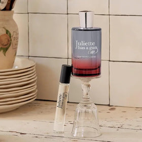 Juliette Has a Gun Ode to Dullness travel spray cap off for quick scent refresh.