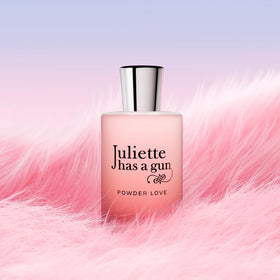 Product texture close-up conveys the soft, powdery aesthetic.