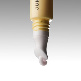 JUNO and Co Lip Milk nourishing beads close-up ready to melt into lips.