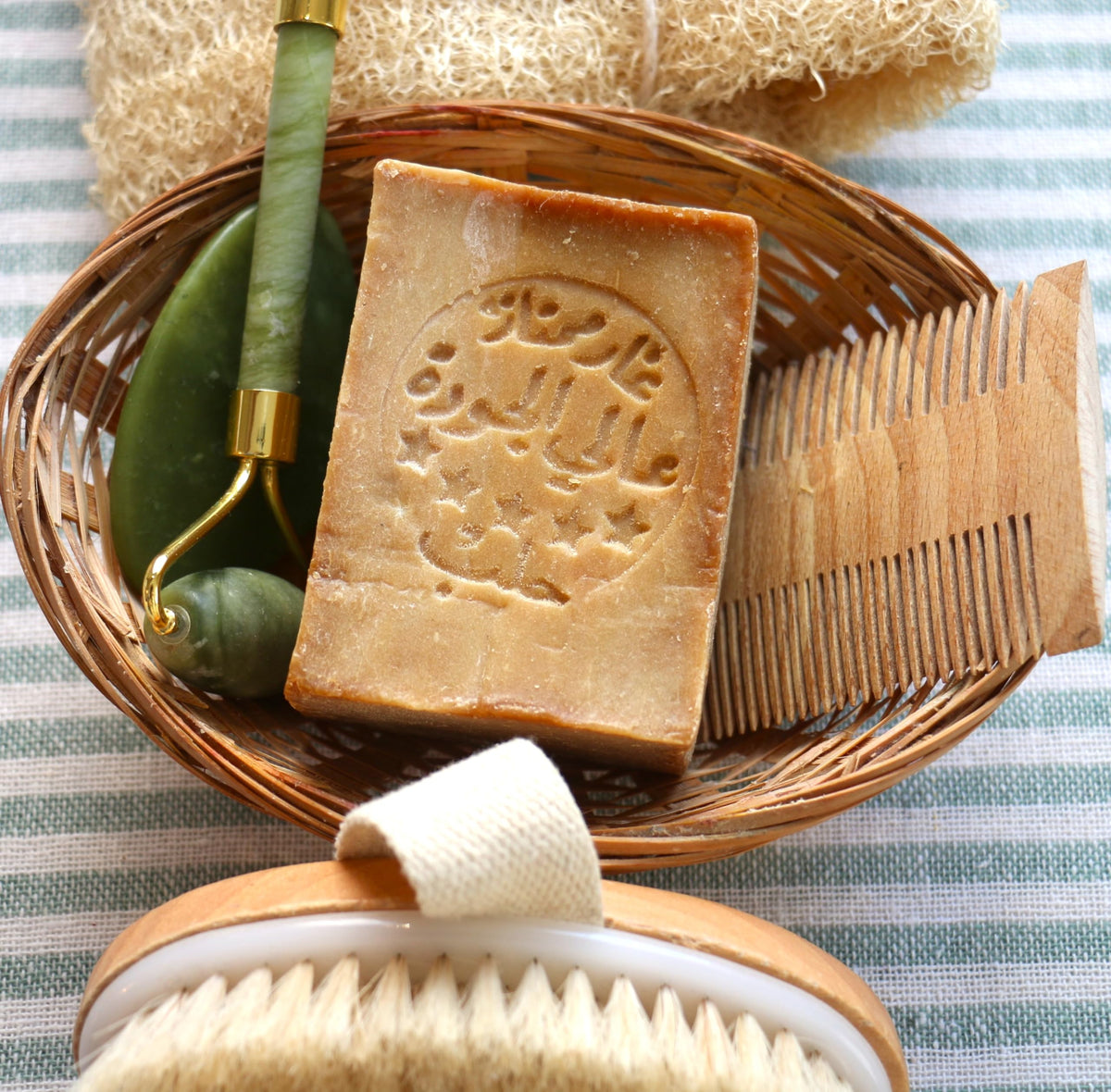JUSIZA Aleppo Soap in bath setting for gentle daily cleansing.