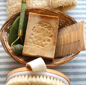JUSIZA Aleppo Soap in bath setting for gentle daily cleansing.