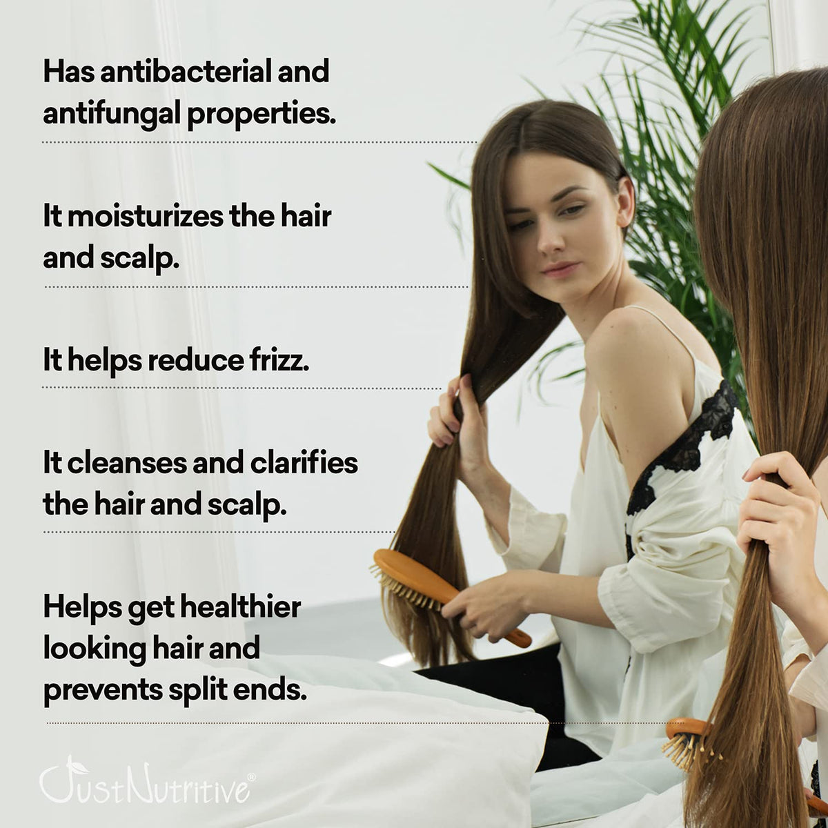 Just Nutritive Vinegar Nutritive Rinse being applied to damp hair to reduce frizz